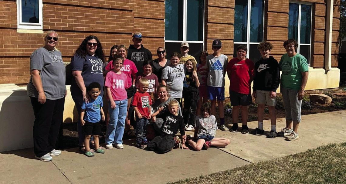 Sayre 4-H plant flowers at Beckham County Courthouse