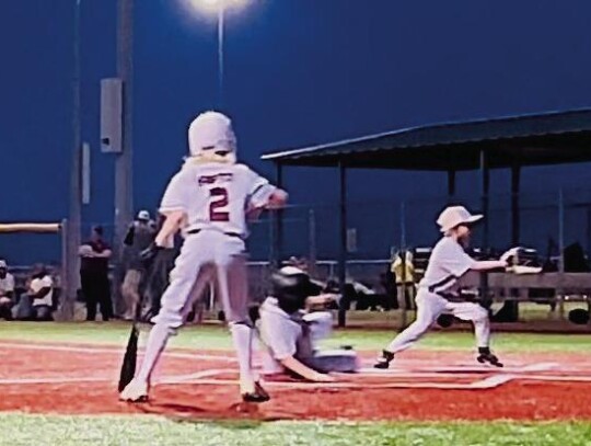 Sayre Eagle Dylan Rippetoe slides into home.