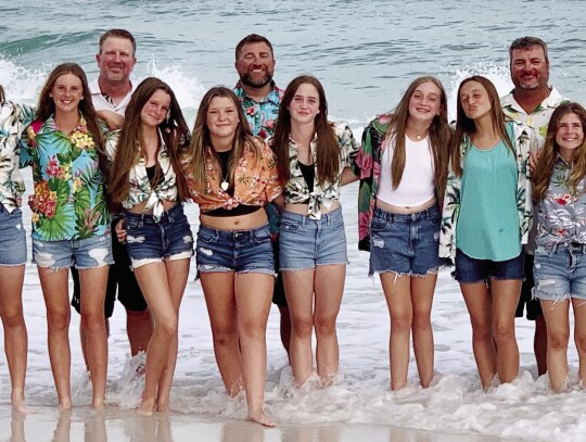 Softball Team and their coaches in Florida.