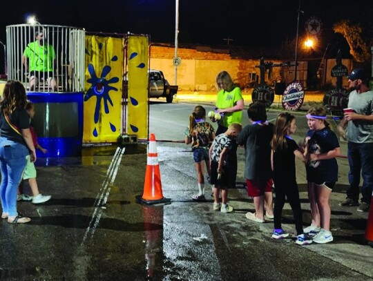 Battle of the Chief’s dunk tank at Sheb’s Shinding on Saturday night: Fire Chief Ricky Laster earlier in the day in the tank. ;Police Chief Wes Henry. He raised the most money for the Emergency Services Christmas Toy Drive.;Ambulance Coordinator Justi