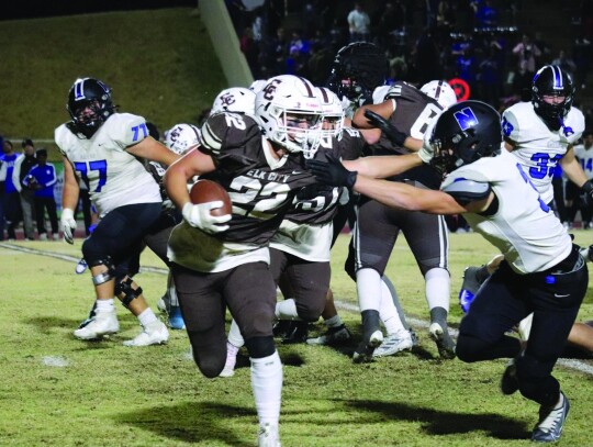 Cooper Garbarino carries in the ball for the Big Elks. He had one touchdown in the final game.