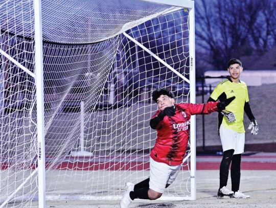 Deviating a shot to goal by the Elk City goalie. Photo by Alex Alvarez