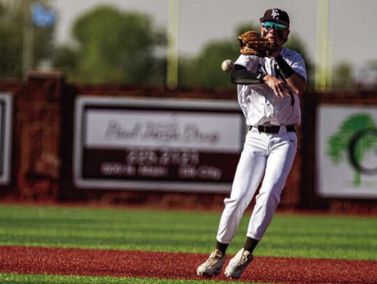 Sports photographer Jake Hodnett catches a ballon- bat photo of Big Elk Bryce Mouse at the plate Max Trotter