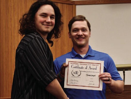 Thomas Smyth, Elk City High School, and WTC-Sayre Welding student earned a Perfect Attendance for the Year Award. Welding Instructor, Kelly Vanderwork is presenting Thomas his award.