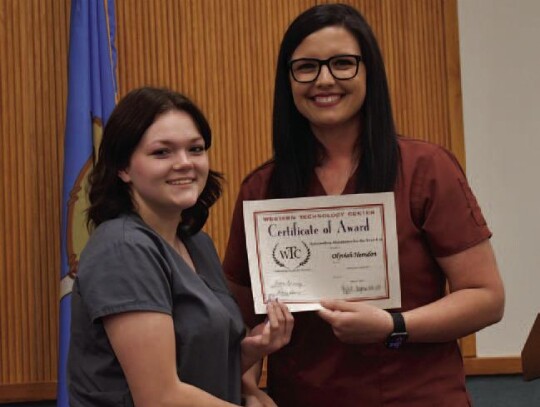 Olyviah Herndon, Merritt High School, and WTC-Sayre Health Careers student earned Perfect Attendance for the Year. Health Careers Instructor, Kylee Chapman is presenting Olyviah her award.