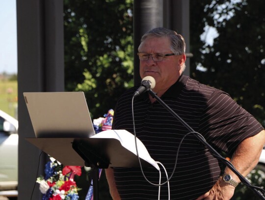 Pictured is Shawn Wilson singing patriotic songs.